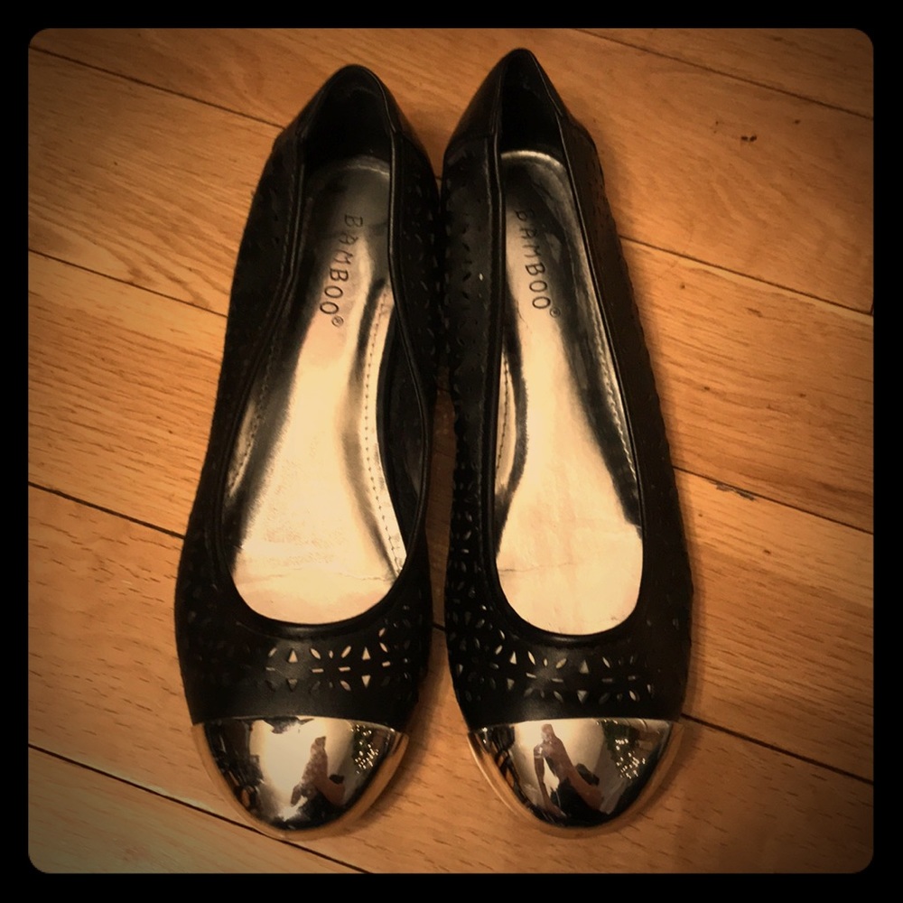 Silver toed black flats